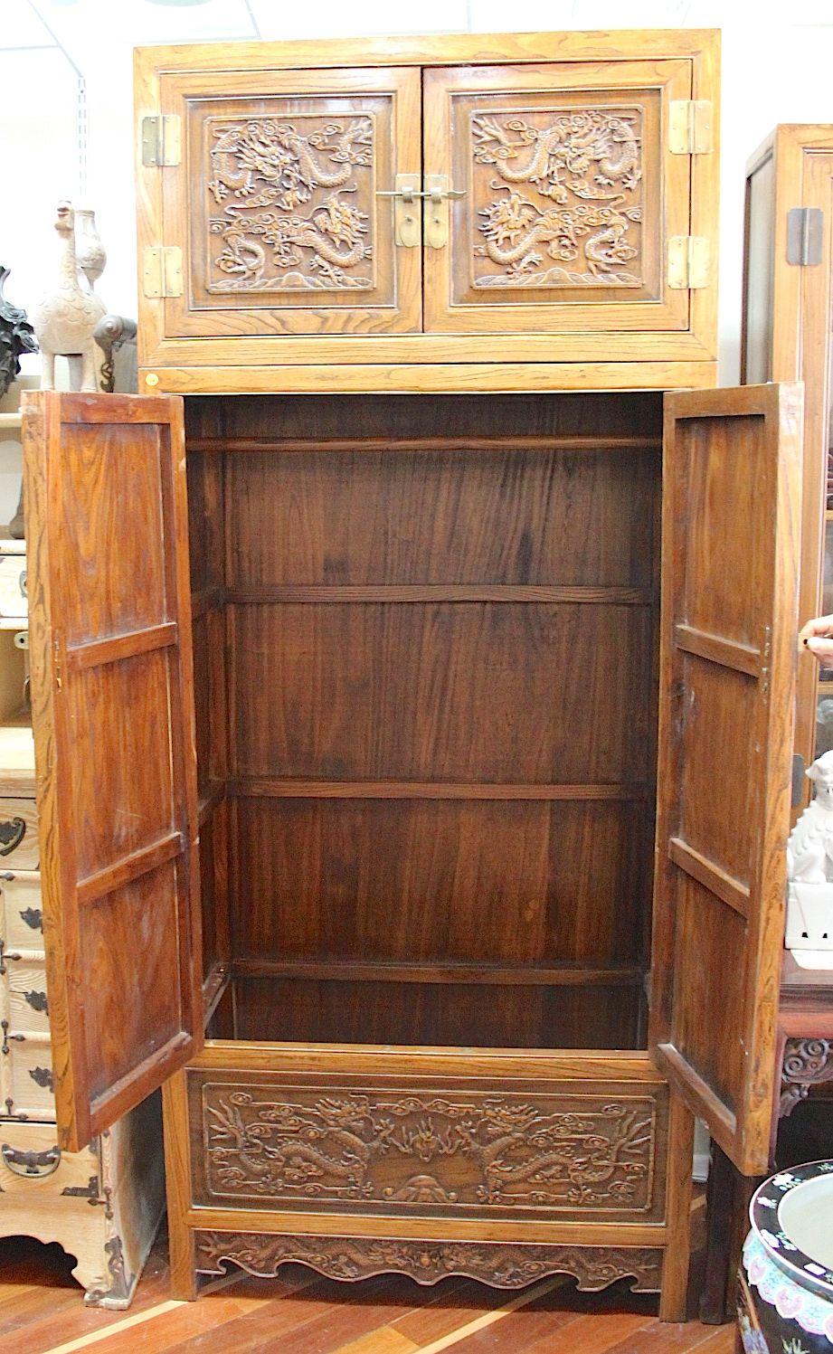 Wooden cabinet with carved dragons motiffs