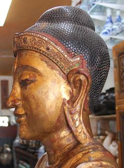 Gold gilted wooden standing Buddha