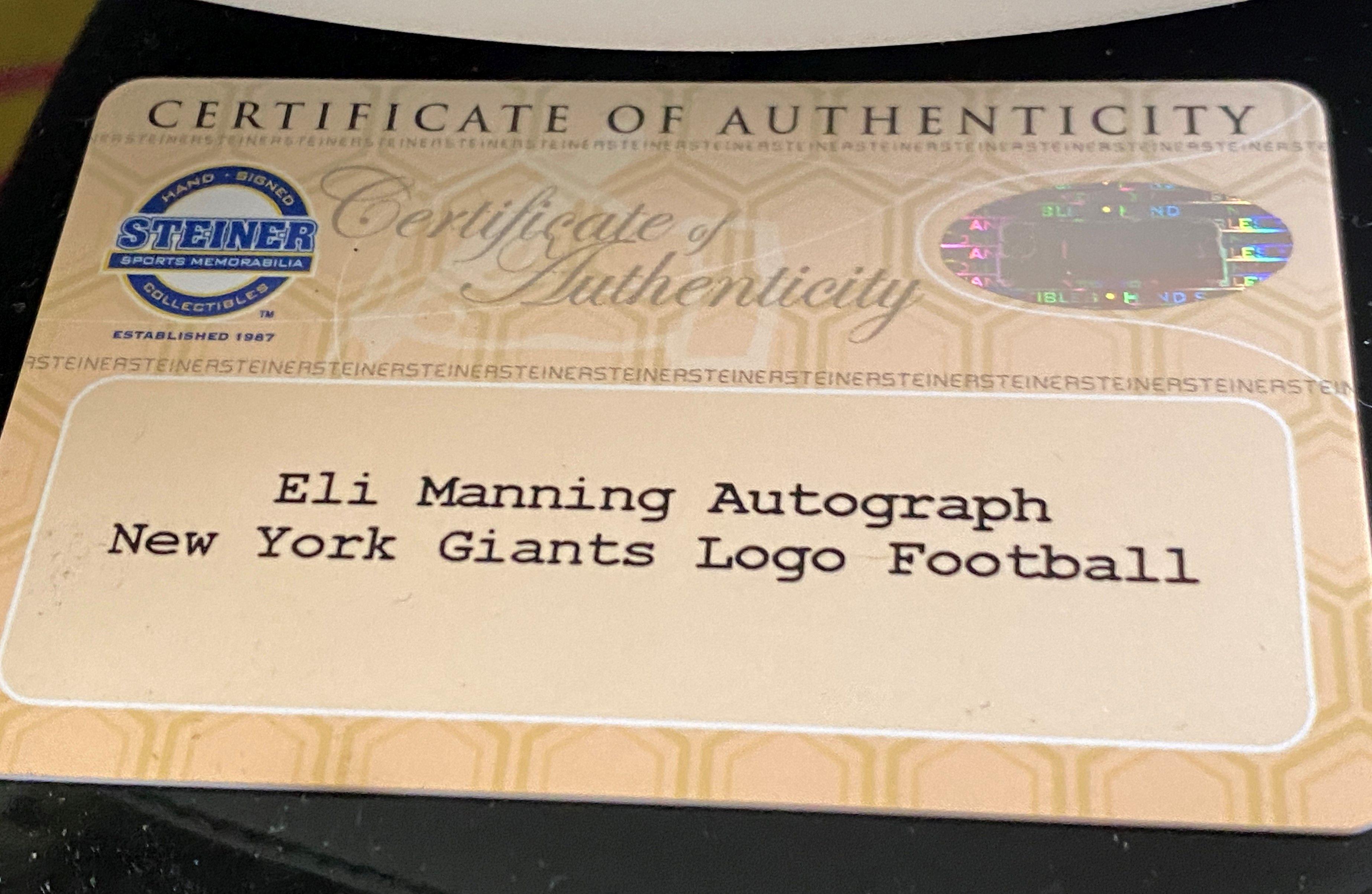 Eli Manning Autographed  New York Giants Logo Ball Autnenticated by Steiner  Sports