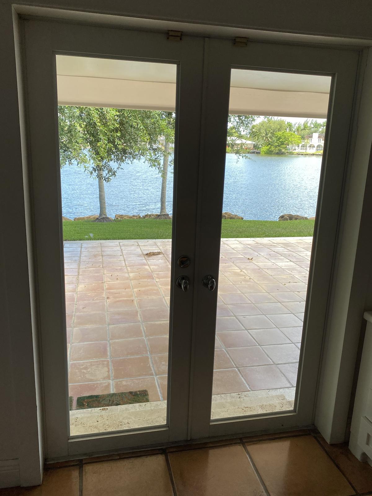 56"W x 77"H Metal Framed French Doors with Stainless Steel Knob Set
