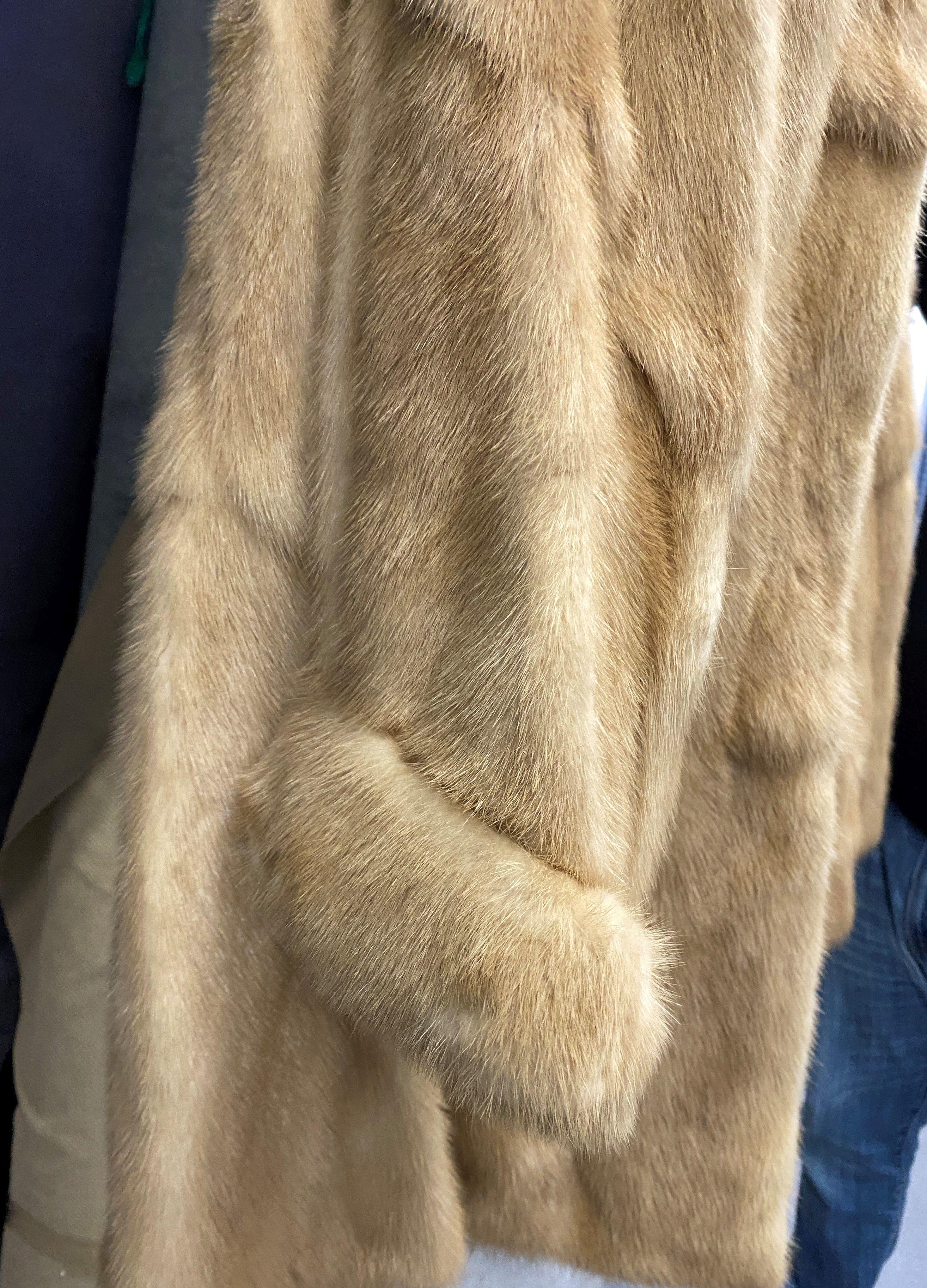 Maximillian Collection Fur Coat from Bloomingdales. The Coat is a size 10, has a Silk inner lining a