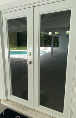 54" Double Entry Door Way With Impact Glass Panels On Each Door, A Brushed Nickel Door Lock And Door