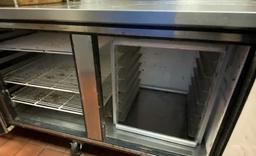 True 93" Refrigerated Table set up inside with speed racks