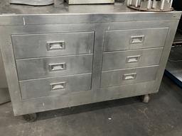 Six Drawer Stainless Steel Work Table With 41" Backsplash. On Casters