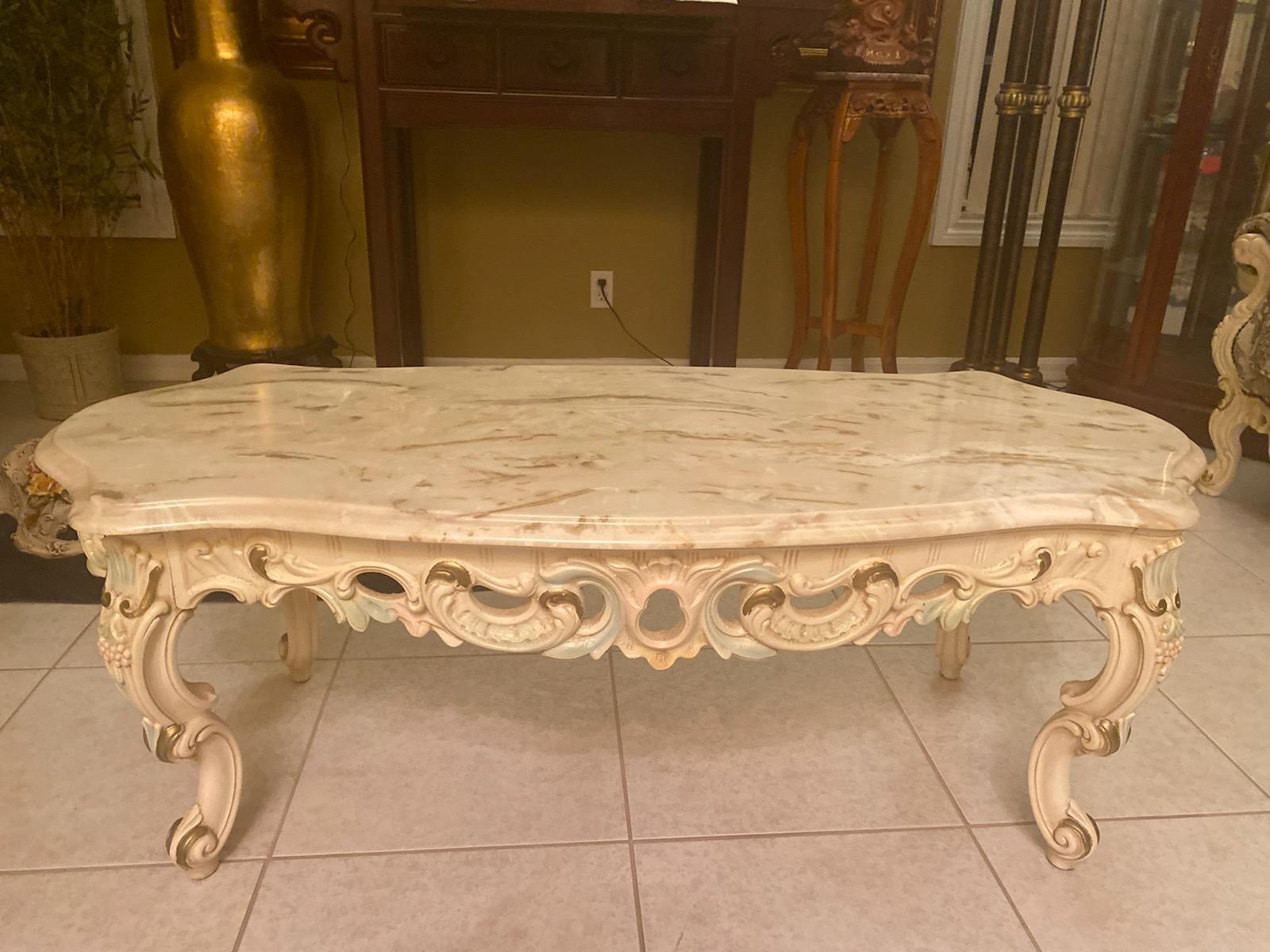 53" Faux Marble And Heavily Carved Wood Coffee Table