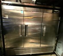 Turbo Air model TSR 72 SD, three Door late model stainless steel refrigerator mounted on caster with