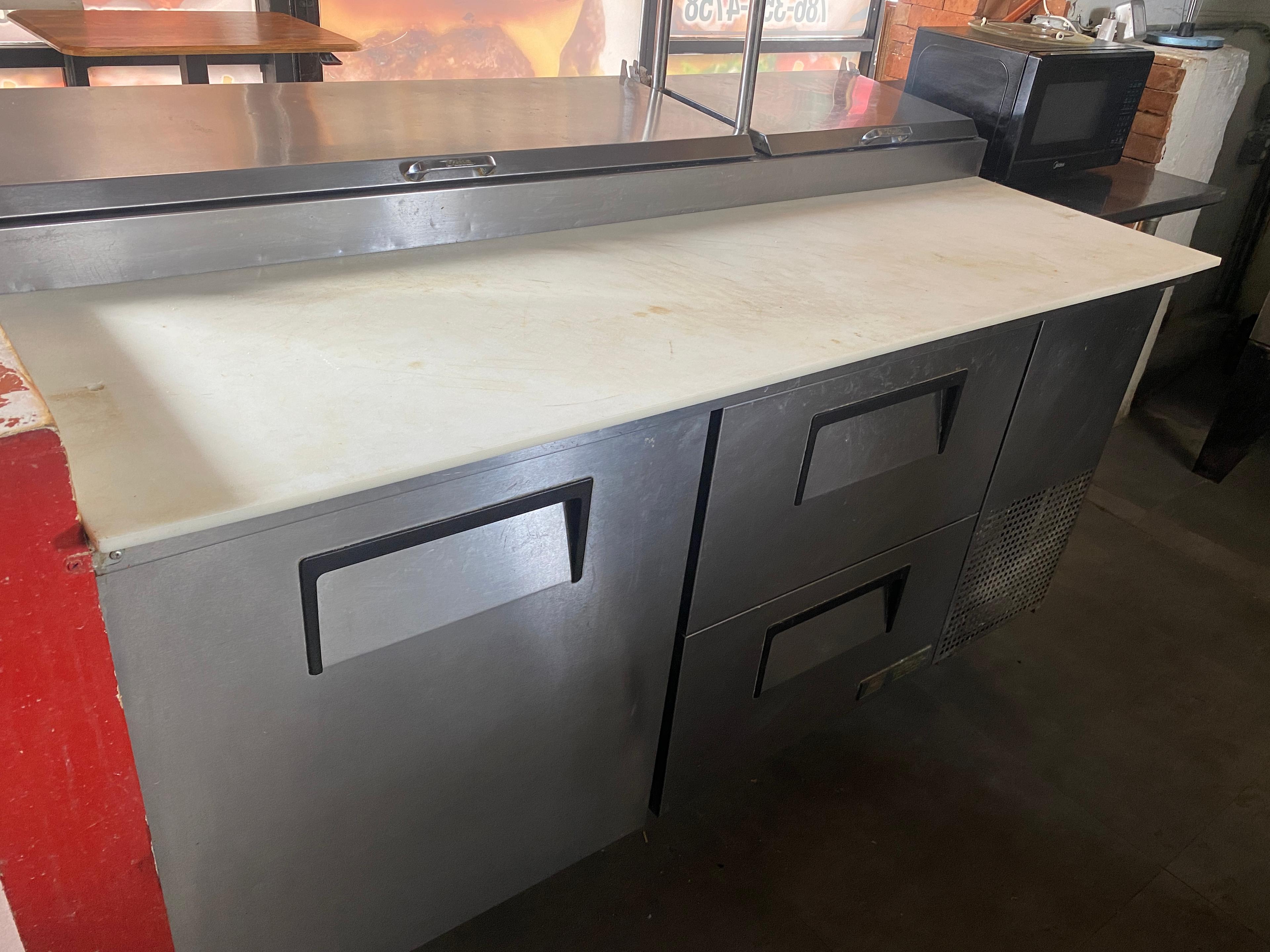 67-inch True refrigerated Pizza prep unit with one door of refrigerated storage and a single epoxy c