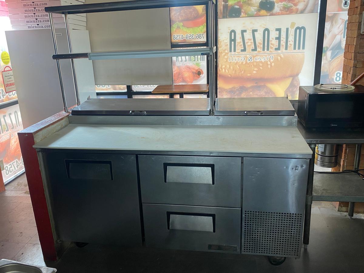 67-inch True refrigerated Pizza prep unit with one door of refrigerated storage and a single epoxy c