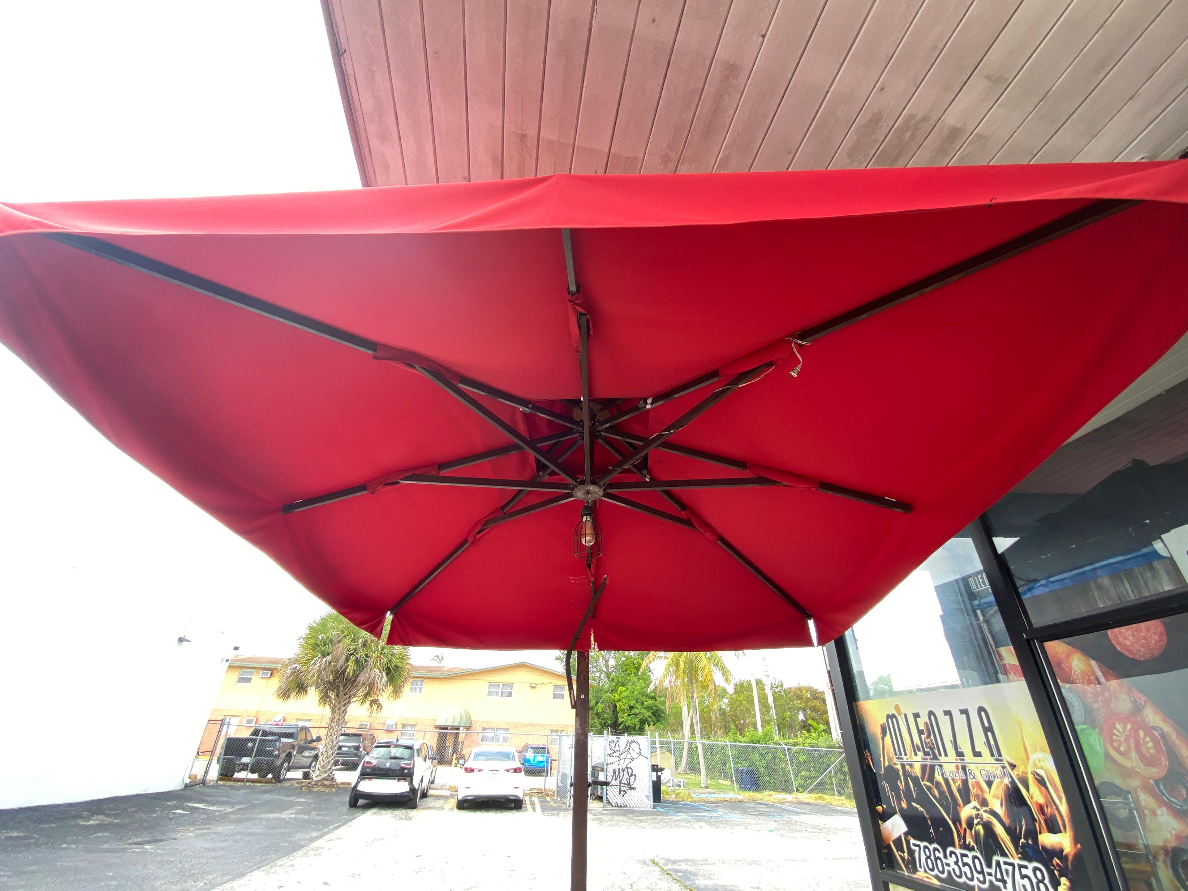 Large 110" Outdoor Canopy Umbrella it does have some tares.