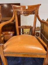 Armchair made in Cherrywood with leather camel upholstery and gold nail head details