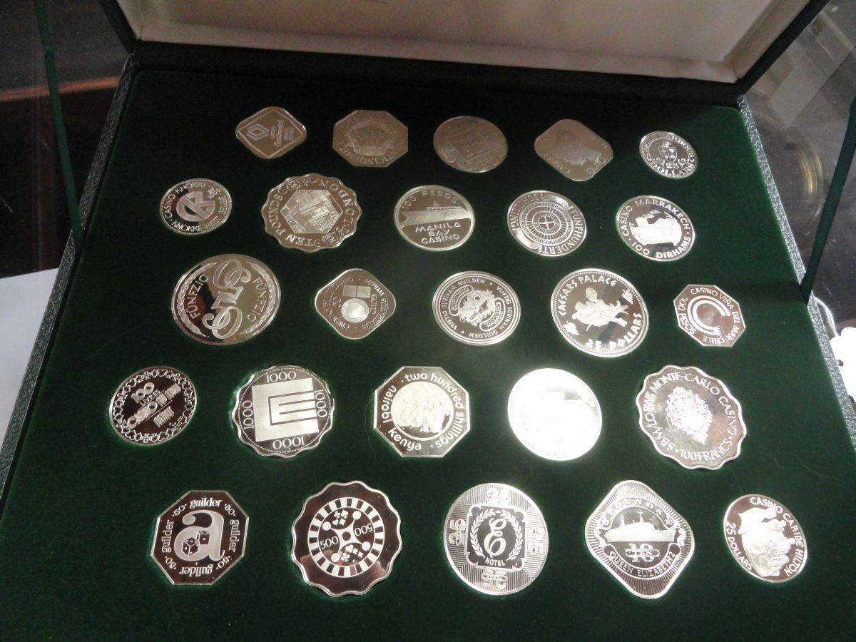 THE OFFICIAL GAMING COINS OF THE WORLD'S GREAT CASINOS.