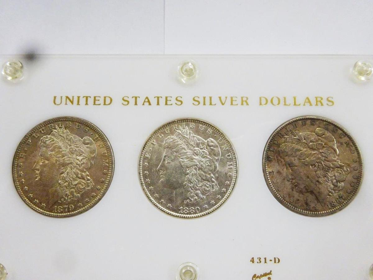 (3) MORGAN SILVER DOLLARS ENCAPSULATED IN DISPLAY, AU-BU CONDITION -