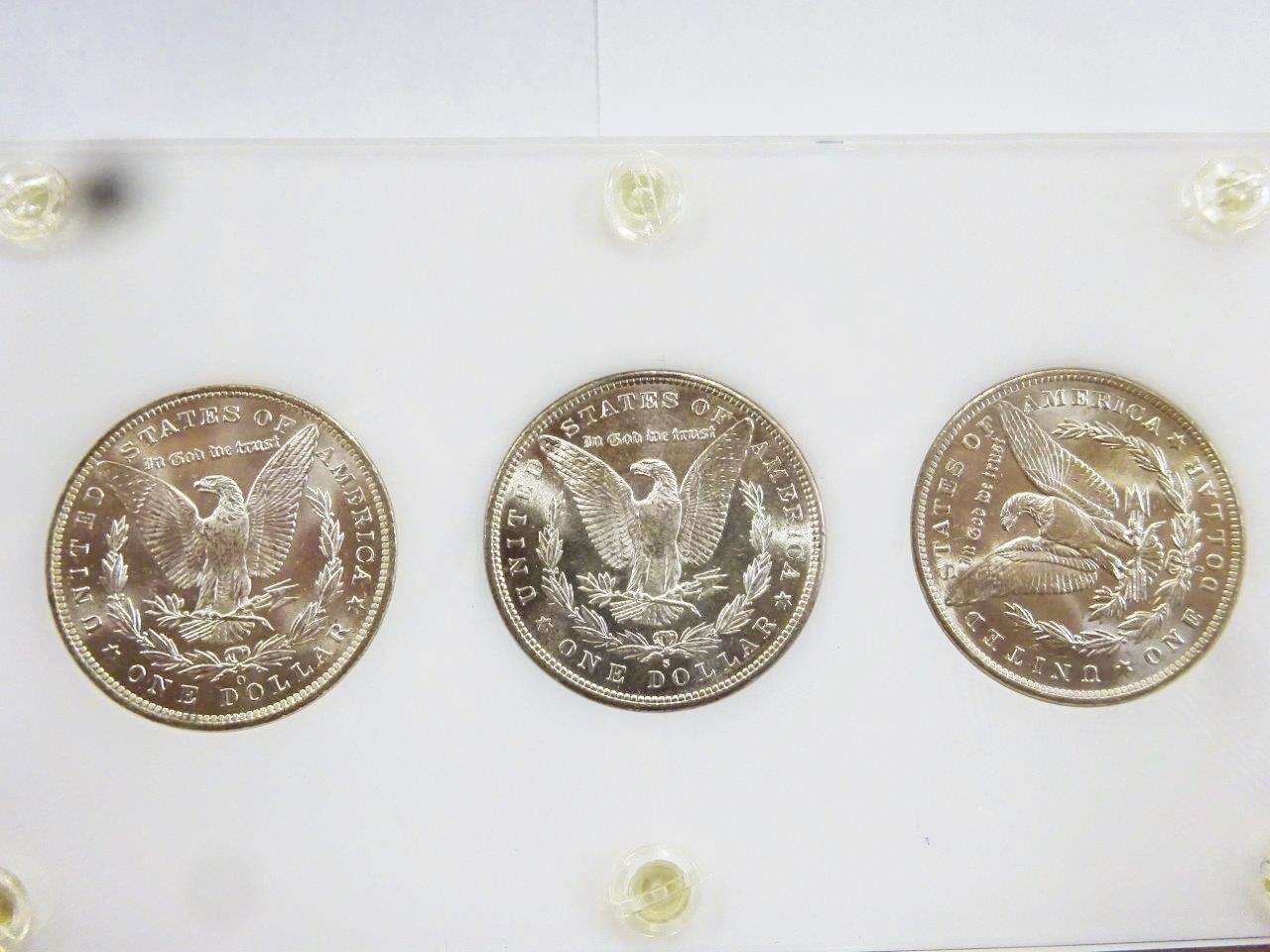 (3) MORGAN SILVER DOLLARS ENCAPSULATED IN DISPLAY, BU CONDITION -