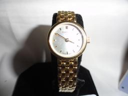 LADIES' TISSOT GOLD TONE WATCH, NEW WITH PAPERS