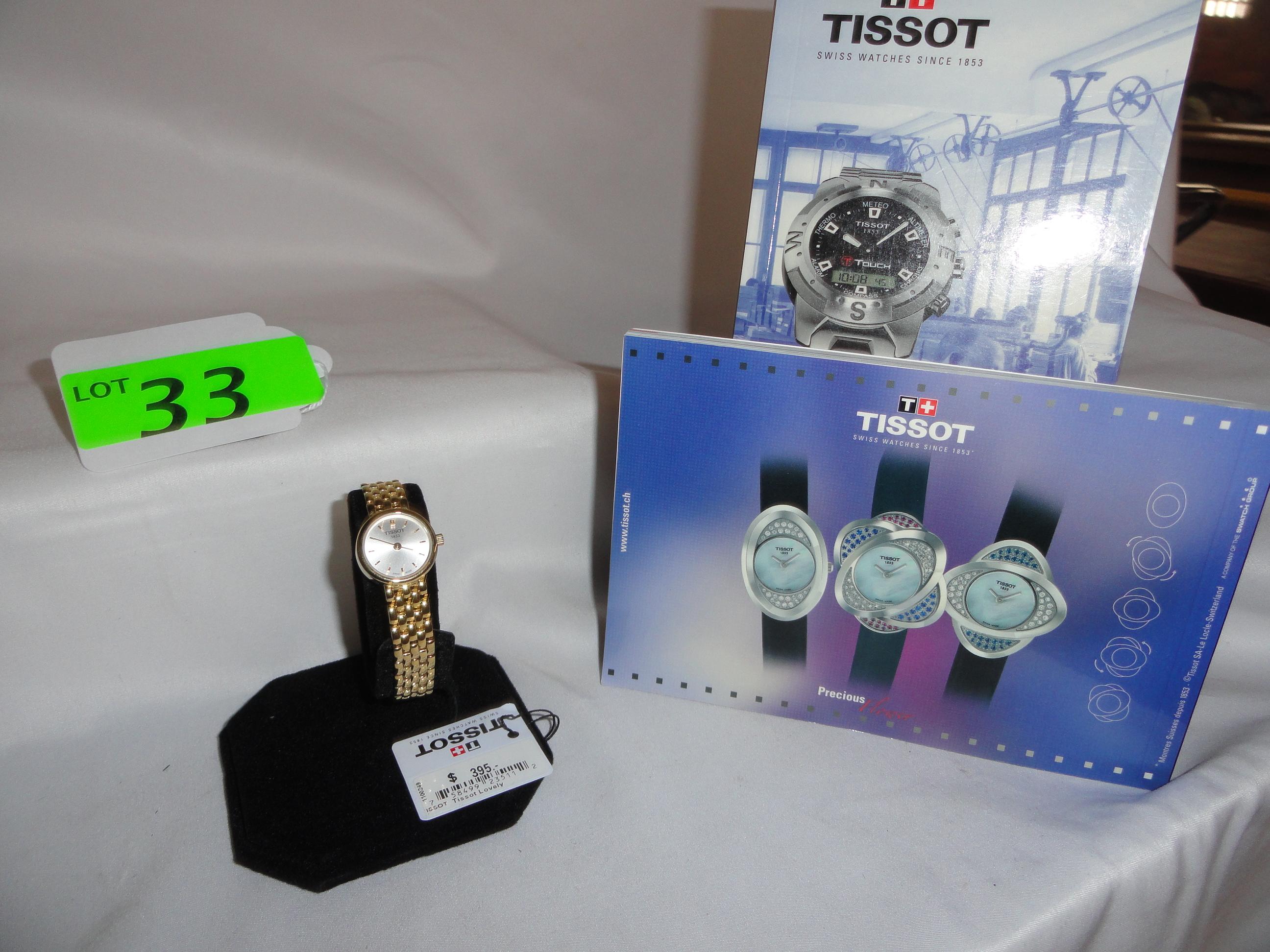 LADIES' TISSOT GOLD TONE WATCH, NEW WITH PAPERS