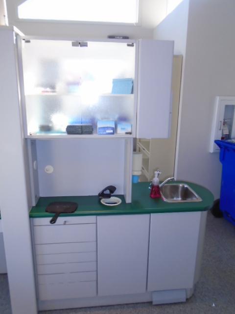 CABINET W/SINK, AIDEC DENTAL LIGHT, & ASSORTED SUPPLIES