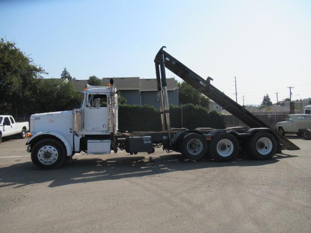 1994 PETERBILT 257 ROLL OFF TRUCK