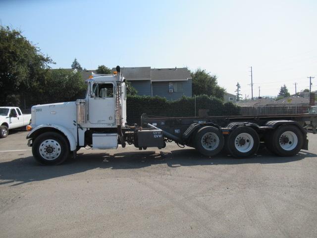 1994 PETERBILT 257 ROLL OFF TRUCK