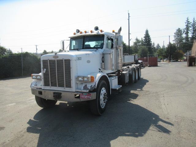 1994 PETERBILT 257 ROLL OFF TRUCK