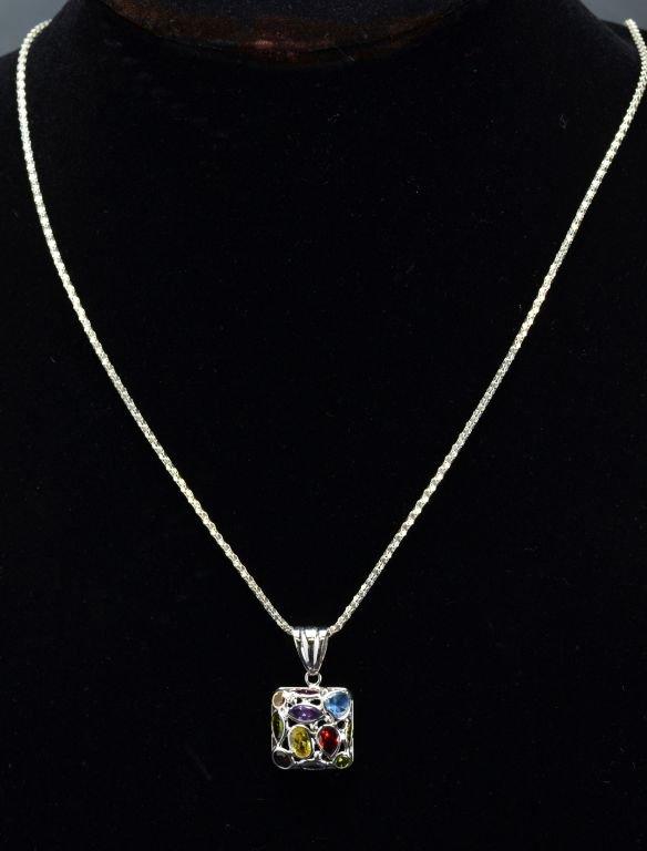 ITEM 47: 14kt. WHITE GOLD MULTI-GEMSTONE PENDANT