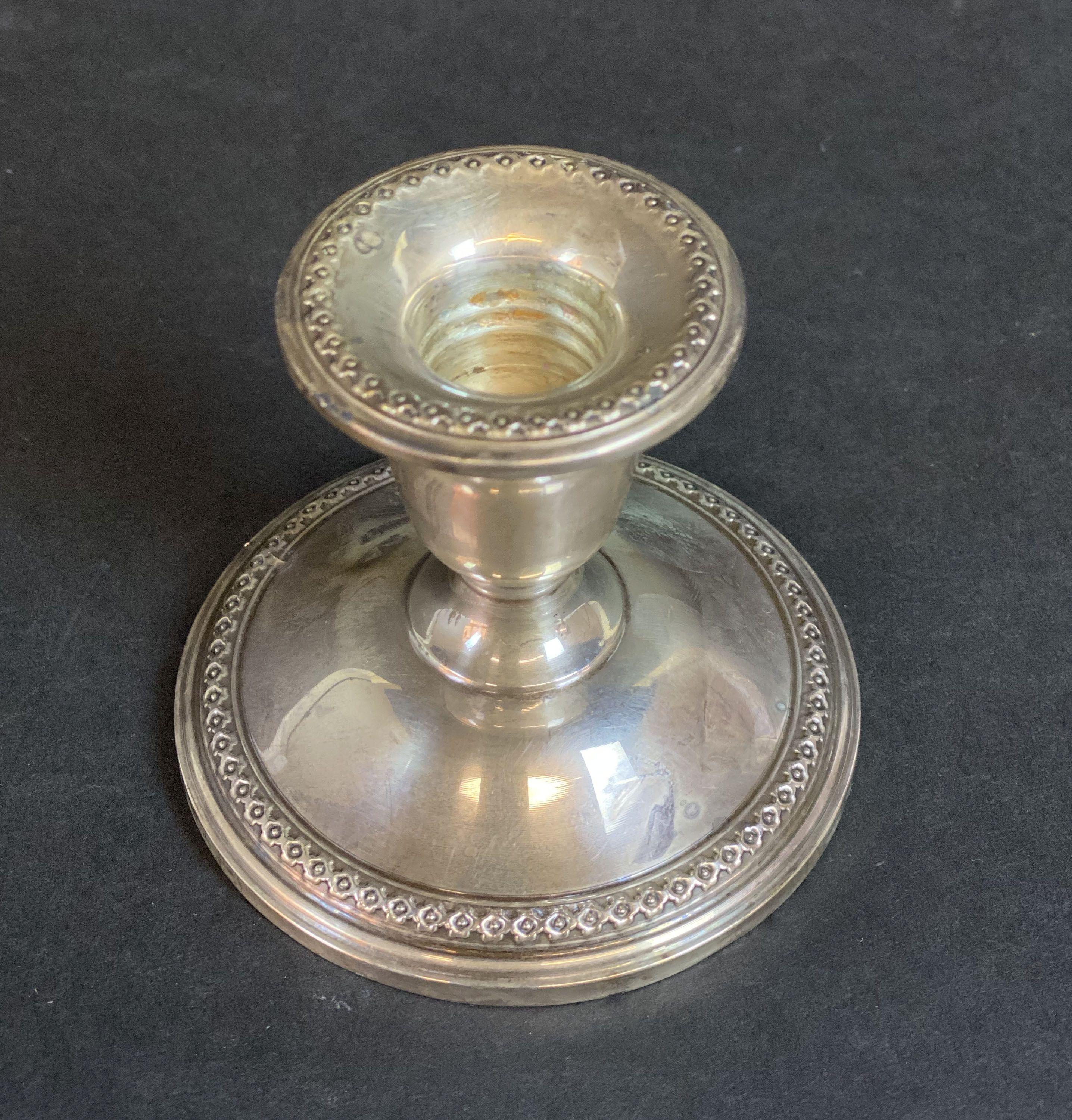 Sterling Silver Salt & Peppers Shakers with a Pair of Candlesticks
