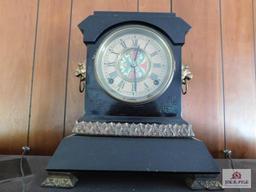 Cast iron mantel clock w/ lions head side handles