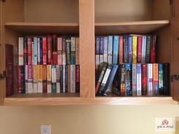 Contents of desk and book cases: paperback books, office supplies, office chair, etc.