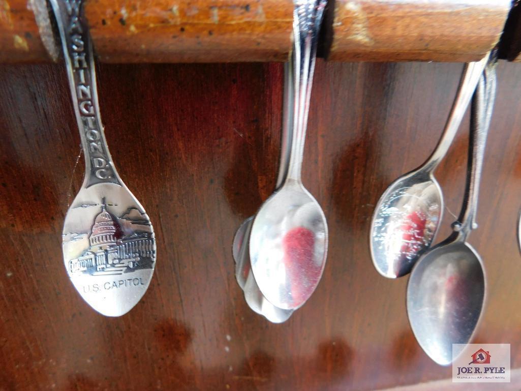 Large collection of state spoons and rack