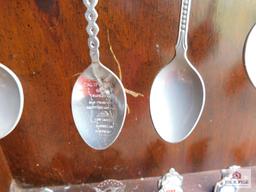 Large collection of state spoons and rack