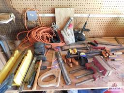 Collection of tools including wood clamps, extension cords, hand sander & miter box