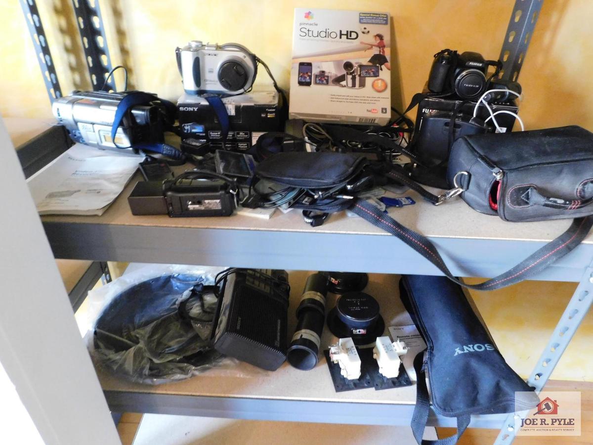 Contents of shelf - Sony video camera recorder, Sony Mavica camcorder, HandyCam, Pinnacle studio HD,