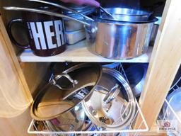 Contents of cabinets - collection of pots and pans, baking pans and muffin tins