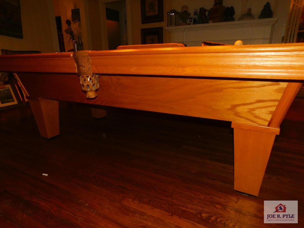 8ft. Oak pool table, leather pockets, and accessories