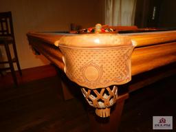 8ft. Oak pool table, leather pockets, and accessories