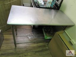 Stainless steel table 2 ft wide, 4 ft long, 36 inches tall