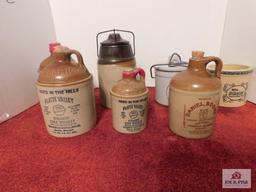 Stoneware whiskey jugs and small crocks