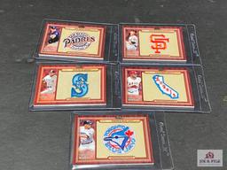 Lot of five 2011 Topps commemorative patch cards.
