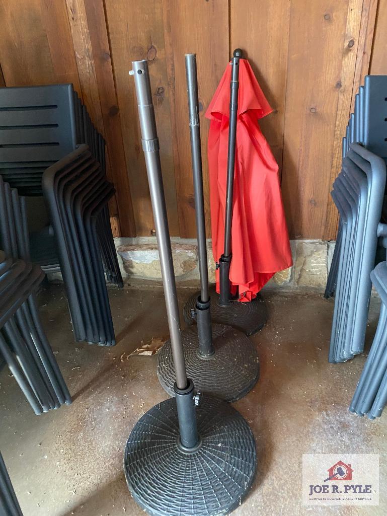 Lot 3 patio umbrella stands and 1 umbrella