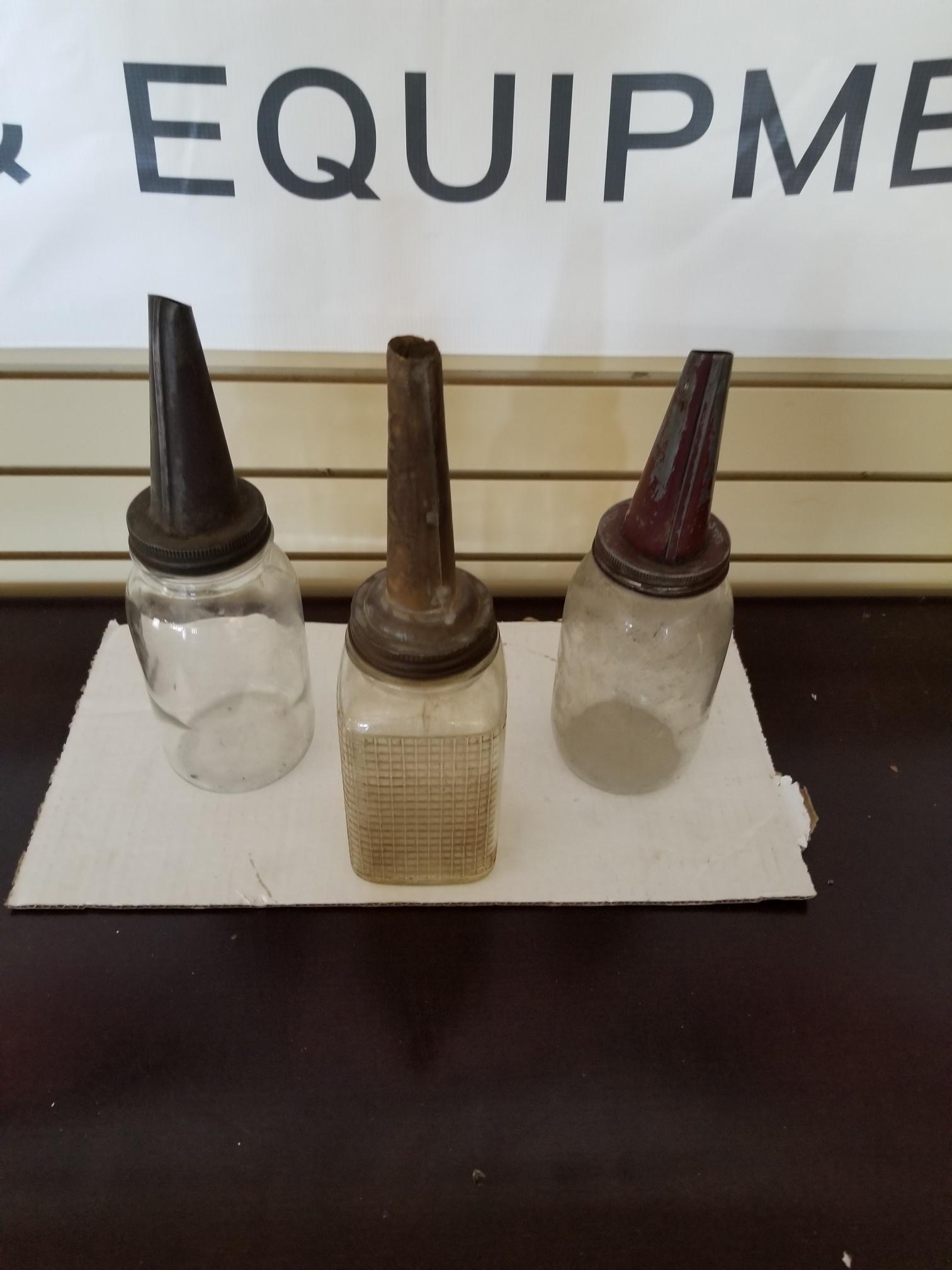 3 oil bottles with spouts