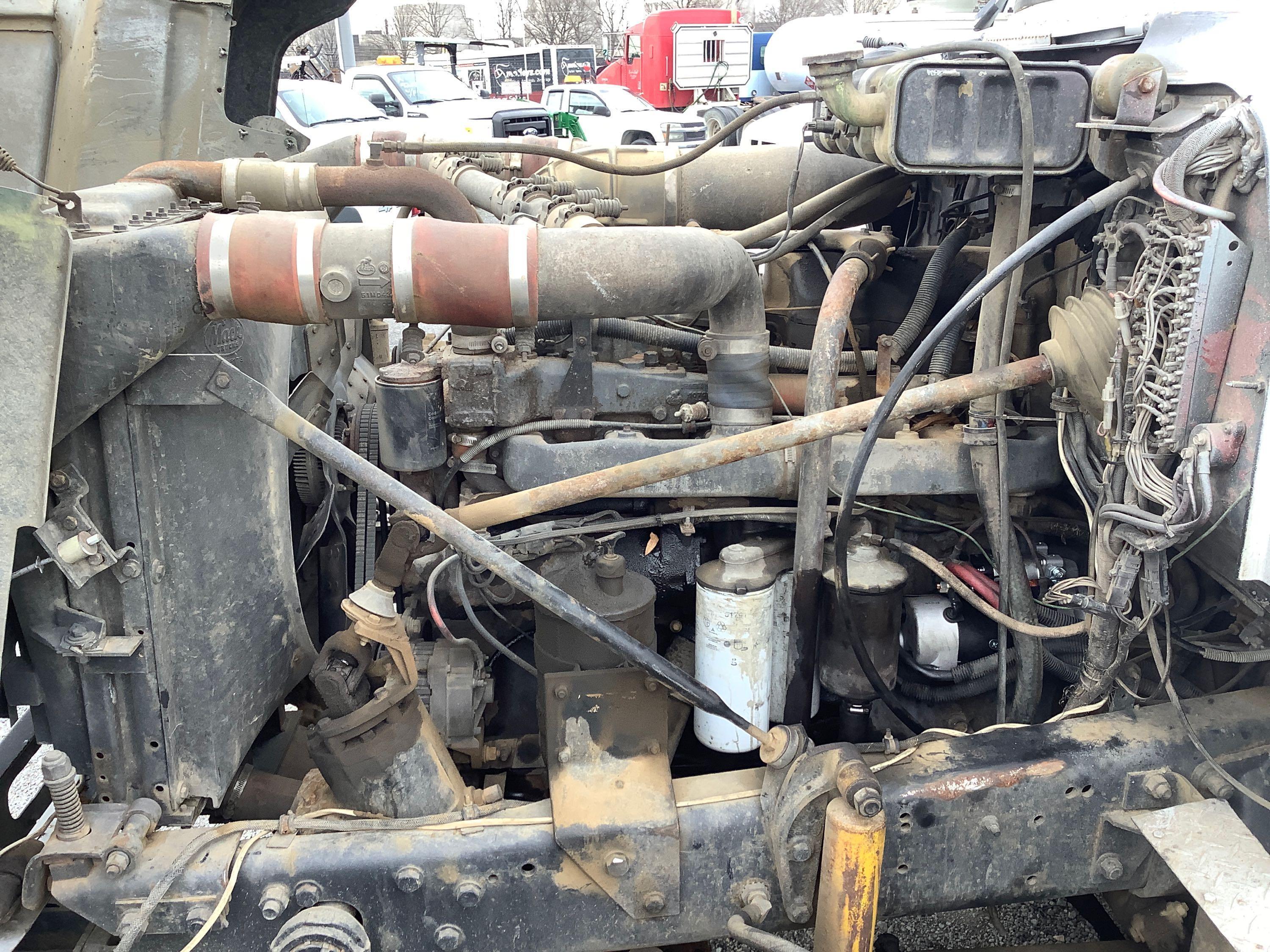 1994 MACK QUAD-AXLE DUMP TRUCK (REBUILT TITLE)