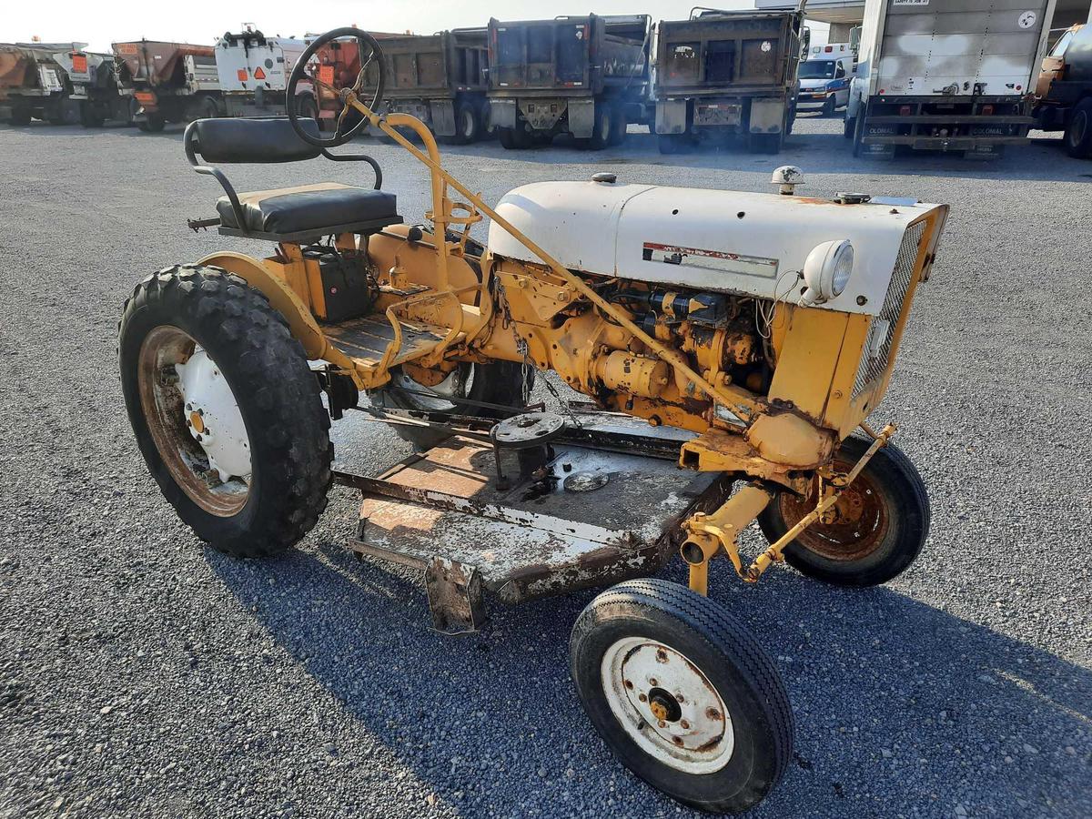 **BID ASSURE** International Cub Farm Tractor W/ Mower Deck Attachment