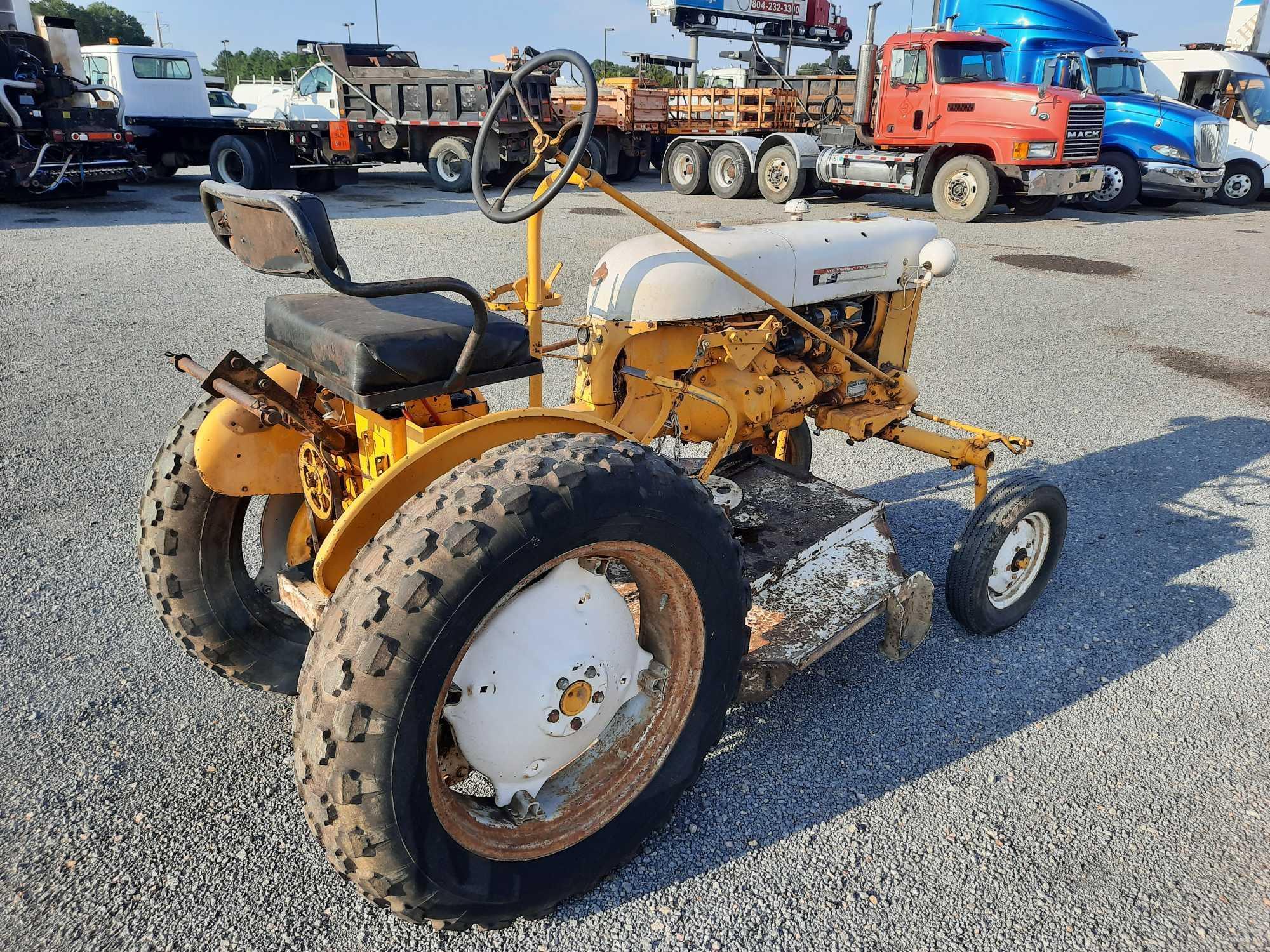 **BID ASSURE** International Cub Farm Tractor W/ Mower Deck Attachment