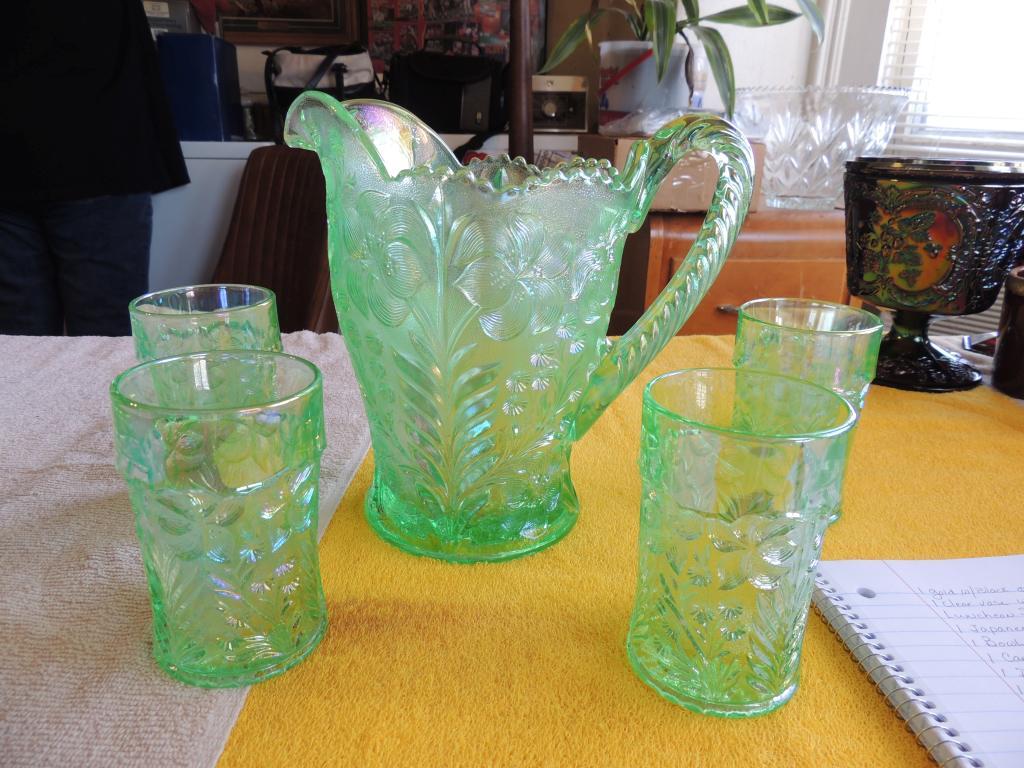 Mint green pitcher with four glasses