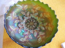 Green carnival glass bowl with leaf pattern