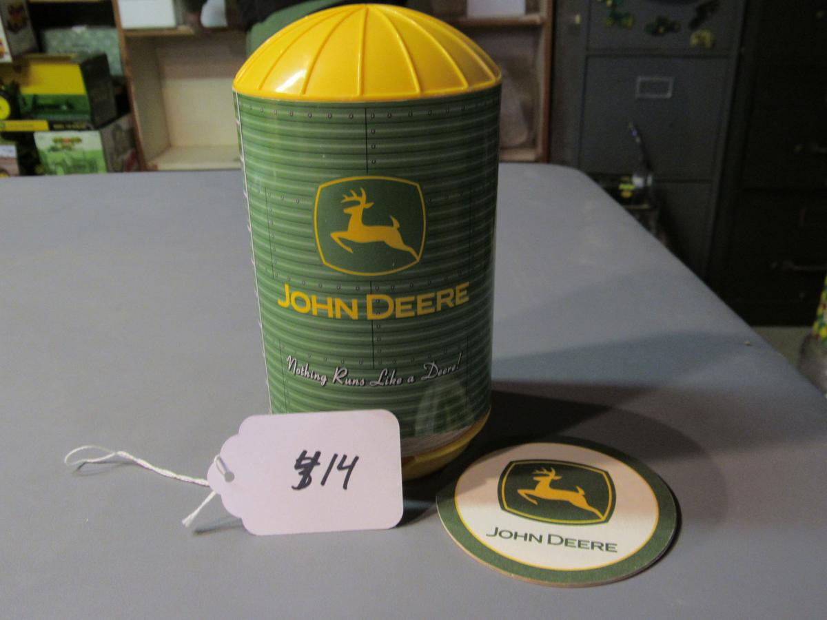 JD cardboard drink coasters in a silo