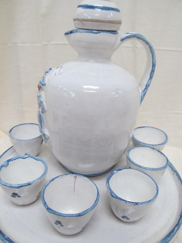 8 PC. SET POTTER PITCHER & CUPS WITH DUTCH DANCERS PITCHER 8" & CUPS 1" & PLATTER 9.25" note: one cu