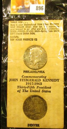1964 P & D Pair of Kennedy Half Dollars in an original Tidy House cardboard holder. No envelope.