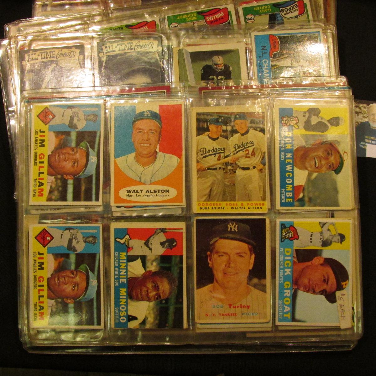 A group of more than (20) Plastic pages with Baseball Cards, some of which have been autographed. A