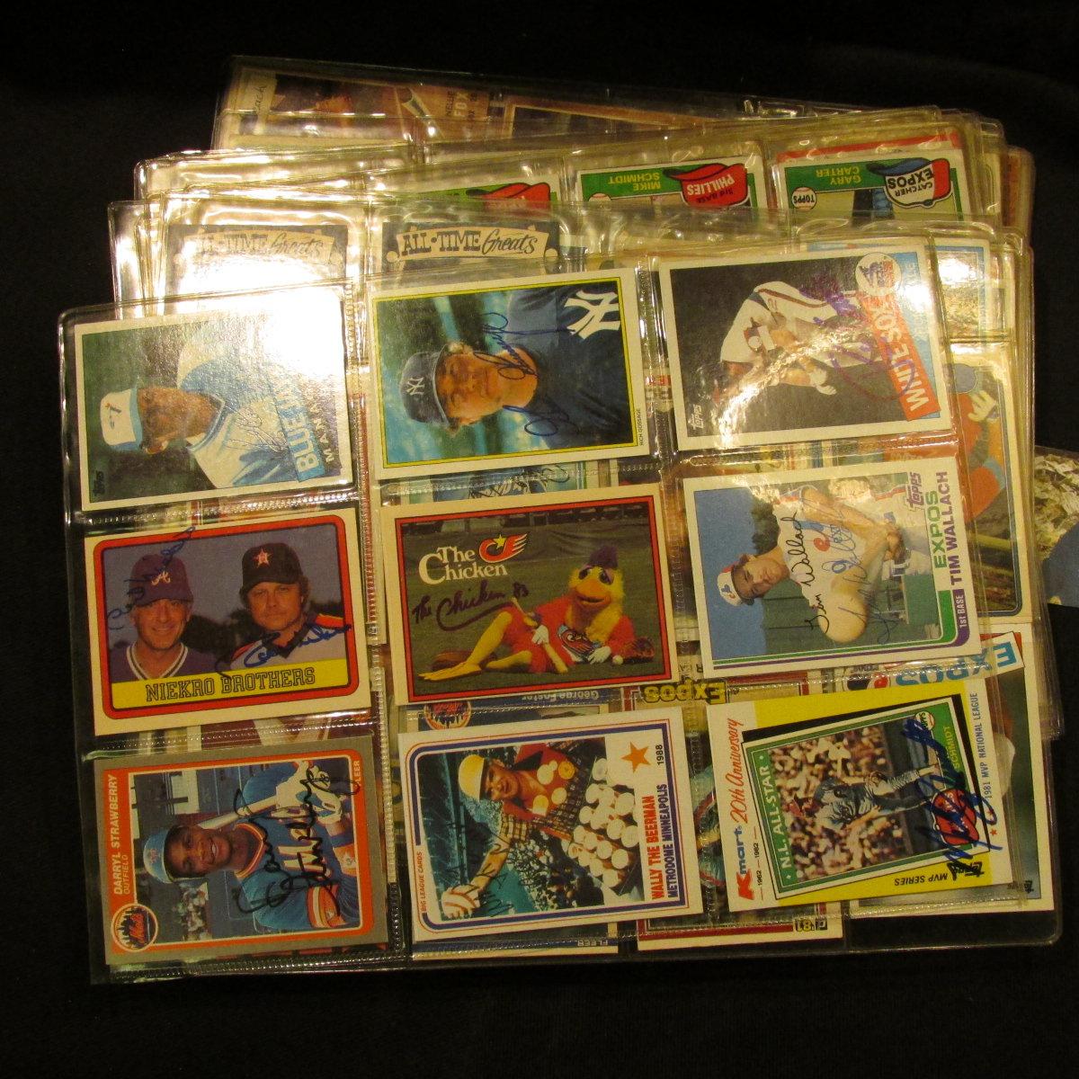 A group of more than (20) Plastic pages with Baseball Cards, some of which have been autographed. A