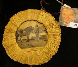 "Trevore Toilet Water" advertising Folk Art titled "The Present", woven reed frame with picture of h